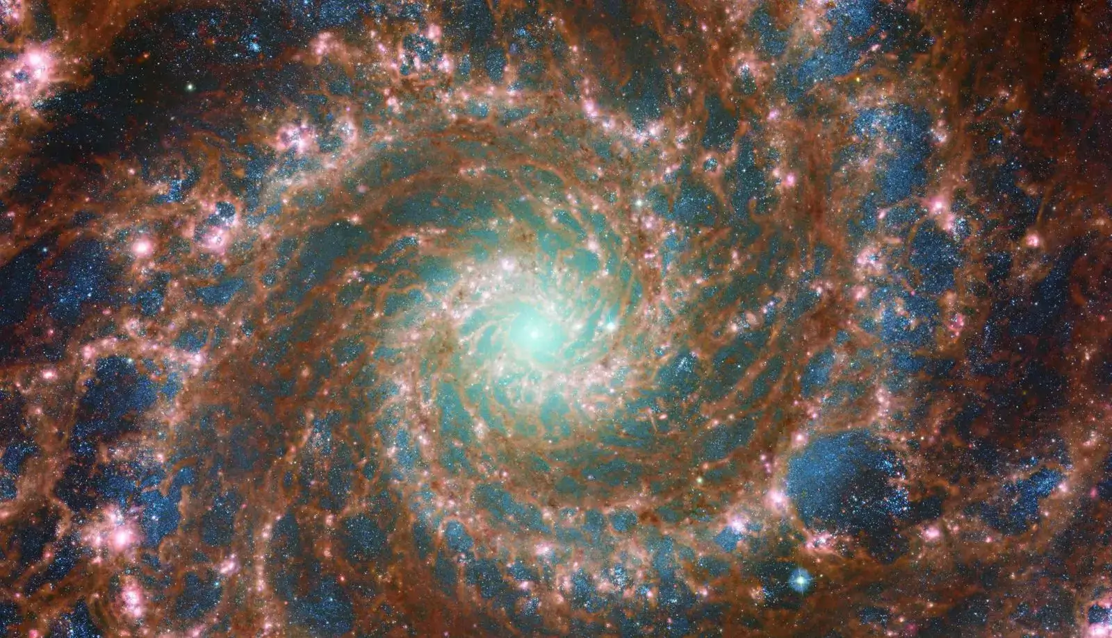 A vibrant spiral galaxy with glowing blue and orange hues.